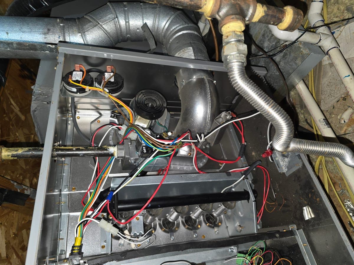 Furnace internals with wiring during repair in an attic in Lewisville TX